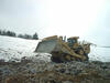 Dozer D11R na hornině, kterou předtím rozrušil rozrývačem