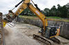 04. Skalní fréza Atlas Copco DC 1200 na pásovém rypadle Caterpillar 329E LN společnosti Biggest